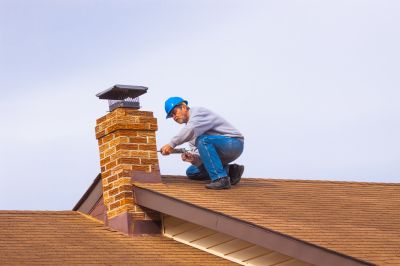 Local Chimney Cap Replacement pros at work